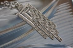 Simply stunning vintage Monet Art Deco Opera length pendant necklace in a brilliant silvertone architectural presentation. Well made with nice weight and feel, in fine vintage condition. Perfect for sweater, Tunic Top, or evening. The articulation is smooth not prone to tangles. NOTE: We are happy to ship to our friends around the globe. Please contact us with any questions or concerns. Thanks for visiting. If you've got a moment, why not kick back and peruse a bit. This shop is filled with litt Monet Art, Vintage Monet, Art Deco Necklace, Wearable Art, Silver Tone, Favorite Jewelry, The Globe, Jewelry Necklace Pendant, Art Deco