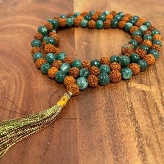 Embrace the harmonious energy of nature with our Handmade 108Ct Rudraksha with Green Jade Healing Prayer Meditation Yoga Success Mala Bead. Designed to bring peace, healing, and success, this sacred mala is perfect for enhancing your spiritual practice and achieving your goals. 🌟 108 Sacred Beads: The mala features 108 Rudraksha beads, a sacred number in meditation and prayer practices, promoting spiritual growth and focus. 🌟 8mm Bead Size: Each bead is 8mm, providing a comfortable and balanced feel during your meditation sessions or as a daily accessory. 🌟 Green Jade Healing Energy: Infused with the powerful healing properties of Green Jade, this mala supports emotional balance, abundance, and success in all aspects of life. 🌟 Sacredly Handmade in India: Crafted by skilled artisans in Spiritual Gemstone Beads Bracelet For Festivals, Traditional Green Beaded Bracelets With 8mm Beads, Spiritual Beaded Necklaces With Natural Stones For Festivals, Spiritual Green Beaded Bracelets With Faceted Beads, Adjustable Green Beaded Necklaces For Meditation, Healing Gemstone Beaded Necklaces For Festivals, Spiritual Green Beaded Necklaces With Natural Stones, Hand-strung Green Mala As Gift, Green Mala Necklace As Festival Gift