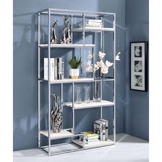 a metal shelf filled with books and vases