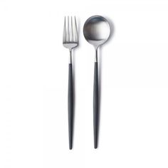 two forks and spoons on a white surface