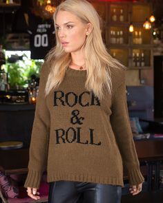 Buttery soft and incredibly cozy, this rocker chic top features the phrase "Rock & Roll" knit directly into the center front. The fit is relaxed and flattering and features mini side slits on each side. Cozy details include ribbing on the neckline, hem and cuff. Composition: 76% acrylic, 12% Mohair and 12% Wool Beach Sweater, Leopard Jeans, Wooden Ship, Graphic Sweaters, Rocker Chic, Soft Clothes, Cozy Cardigan, Oversize Knit, Oversized Knitted Sweaters