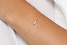 "Baguette Diamond Bracelet in 14k Solid Gold / Dainty Diamond Bracelet / Minimal Diamond Bracelet / Baguette Diamond / Black Friday Made to Order. * Gold Kt: 14K Solid Gold * Custom Gold Color: Rose Gold, Yellow Gold, White Gold * Baguette Diamond: 2 pcs 3 x 1.5 * Total Number of Stones: 2 * Total CTW: 0.12 Ctw * Diamond Color Clarity: G Color VS Clarity * Setting Type: Prong * Ready to Ship in 7-10 Business Days If you have any additional questions about this ring, just hit the \"Ask a Question 14k Gold Diamond Bracelet With Baguette Diamonds For Anniversary, Delicate Baguette Cut Jewelry For Formal Occasion, Delicate Baguette Cut Formal Jewelry, Wedding Baguette Diamond Bracelet With 17 Jewels, Wedding Diamond Baguette Bracelet With 17 Jewels, Minimalist Baguette Diamond Bracelets For Formal Occasions, Minimalist Formal Bracelets With Baguette Diamonds, Rectangular Diamond Bracelet With Baguette Diamonds For Gift, Elegant 14k Gold Bracelet With Baguette Diamonds