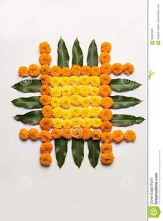 an arrangement of orange and yellow flowers arranged in the shape of a square stock photo