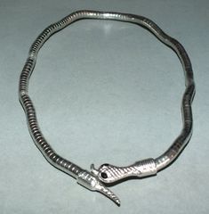 This flexible necklace with snake design rhodium plated metal beads. It can be used as a bracelet originates from Thailand. The necklace is from one end to the other 47cm long. The diameter of the beads is 0.7 cm. Its weight is 25 gram. (e8) SHIPPING SHIPMENT is FREE. All items are shipped within two working days after receipt of payment. We send everything by registered airmail. Insured packets (over 50 cm length / over 1500 gram) I send by standard way. PAYMENT Paypal is preferred. RETURN POLI Silver Metal Snake Bracelets, Silver Metal Snake Bracelet, Silver Snake-shaped Bracelet For Gift, Elegant Flexible Snake-shaped Bracelet, Adjustable Metal Snake-shape Bracelet, Metal Bead Bracelet, Snake Design, Beads Bracelet, Jewelry Maker