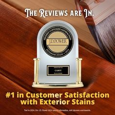 the award for best customer satisfaction is displayed on a wooden table with an image of a paintbrush