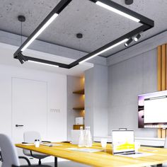 an empty conference room with two laptops on the table