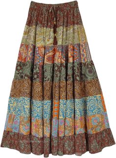 A beautiful multi-panel long skirt with a good fall and floral brown and other prints. The skirt has an elastic waist with a tassel drawstring. #tlb #Patchwork #MaxiSkirt #Printed #TieredSkirt #Summerskirt Long Skirt Pattern, Skirt Patchwork, Brown Clothing, Skirt Tiered, Estilo Hippy, Hippie Skirts, Hippie Look, Hippie Style Clothing, Trendy Skirts