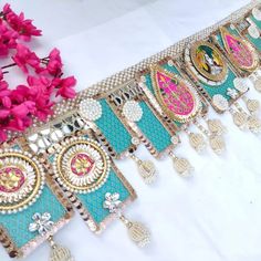 a table topped with lots of different types of bracelets and flowers on top of it