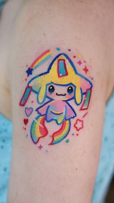 a small tattoo on the arm of a girl with a rocket ship and stars around it