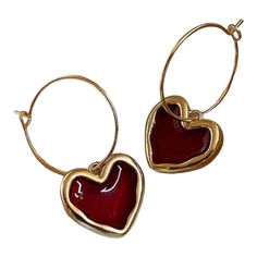 Add a touch of elegance and sophistication to your outfit with these stunning gold with red resin hoop earrings. Measuring at a delicate 1.5" x 1", these thin gold hoops are exquisitely designed with a vibrant red resin heart charm, creating a beautiful contrast. Whether you're attending a formal event or looking to elevate your everyday look, these earrings are the perfect choice. Made with attention to detail and featuring a secure closure, these earrings will add a pop of color and style to a Resin Hoop Earrings, Red Earrings, Gold Hoops, Pretty Jewellery, Vibrant Red, Heart Charm, Red Gold, Everyday Look, Formal Event