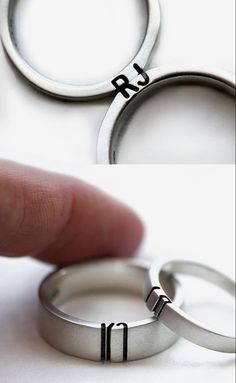 two wedding rings with the word love written on them