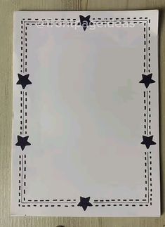 a piece of paper with black stars on it