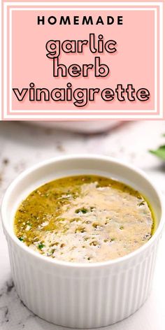 homemade garlic herb vinaigrette in a white bowl on a marble countertop