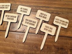 five wooden signs with different words on them