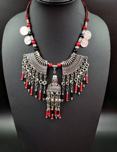 Stikingly dramatic Afghani coin necklace with metal fringe in oxidized silver, so as to create the patina of a vintage tribal piece. Has a modern, edgy vibe to it. Striking! Dramatic! Almost architectural! Strung on cotton cord, adjustable length using a sliding bead, to ensure a perfect fit for you! find even more awesome necklaces here: https://www.etsy.com/shop/BoutiqueByMaryam?section_id=21694658 check out the rest of my shop here: https://www.etsy.com/shop/boutiquebymaryam Vintage Tassel Jewelry For Festival, Bohemian Metal Tassel Necklace As Gift, Festival Silver Alloy Necklaces, Bohemian Alloy Necklace, Silver Bohemian Tassel Necklace As Gift, Bohemian Silver Tassel Necklace Gift, Handmade Bohemian Coin Necklace For Festival, Bohemian Alloy Necklaces For Festivals, Bohemian Alloy Necklace For Festival