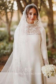 a woman in a wedding dress and veil