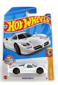 a white toy car is in the package