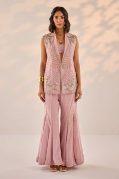 Onion pink sleeveless blazer jacket with all over flora embroidery. Paired with a pearl lines embroidered sharara and a ruched bustier blouse. - Aza Fashions Jacket With Sharara, Jacket Kurtis For Women, Ethnic Jackets For Women Indian, Bollywood Style Pink Floral Embroidered Sharara, Pink Sharara With Intricate Embroidery, Elegant Semi-stitched Pink Sharara, Pink Embellished Organza Sharara, Pink Semi-stitched Sharara With Intricate Embroidery, Stylish Kurtis Design