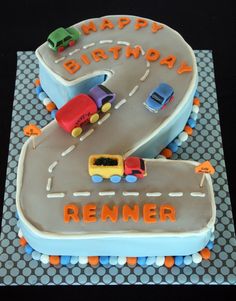 a birthday cake that is shaped like a road