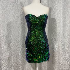 Cocktail Sequence Sherrihill Strapless Short Dress Sequins Go From Small To Big As It Goes Down This Dress Is Nwot No Signs Of Use In Excellent Condition Green Strapless Dress With Sweetheart Neckline For Night Out, Green Strapless Evening Dress For Party Season, Green Fitted Strapless Cocktail Dress, Green Strapless Evening Dress For Cocktail, Strapless Green Evening Dress For Cocktail, Green Strapless Evening Dress For Night Out, Strapless Green Evening Dress For Night Out, Strapless Green Mini Dress For Formal Occasions, Green Strapless Mini Dress For Formal Occasions