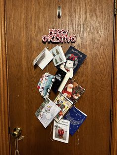 the door is covered with christmas cards and magnets