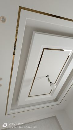 the ceiling is painted white with gold trim