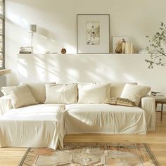 a living room with a white couch and rug