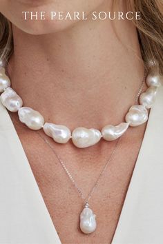 female wearing to pearl necklaces. one pearl necklace has large pearls, baroque pearls the other pearl necklace is a single pearl. pearl necklaces for women. pearl necklace design. This strand is absolutely gorgeous and represents the finest of the finest for Freshwater pearls. This strand also includes rare and large pearls, with a centerpiece that measures at 16mm. AAA quality pearls with a high level of luster bring out the beauty of this gorgeous pearl necklace. Fine Jewelry Briolette Pearl Necklace, Luxury Pear-shaped Pearl Drop Necklace, Luxury Pear-shaped Pearl Chain Necklace, Pearl White Pearl Necklace With Charm, Luxury Baroque Pearl Necklace In Pear Shape, Classic Teardrop Baroque Pearl Necklace, Classic Pear-shaped Baroque Pearl Necklace, White Gold Pearl Charm Necklace, White Gold Pearl Necklace With Pear-shaped Charm