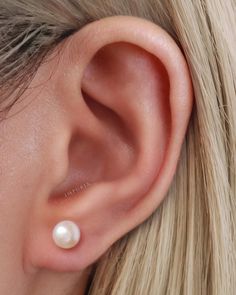 Add a touch of sophistication to your earring collection with our Eternal Pearl Stud Earrings, a reflection of timeless beauty that transcends fleeting trends. The understated design of the stud earrings allows the pearls to take center stage, making them versatile enough to complement any outfit, from casual ensembles to formal attire. All products are nickle-free and hypoallergenic. Item sold in sets. SPECIFICATIONS Gauge: 20G (0.8mm) Material: Sterling Silver Color: Silver Pearl Dimension: 8m Tragus Conch, Barbell Earrings, Helix Earrings, Solid Gold Earrings, Earrings Inspiration, Pearl Stud Earrings, Luxury Gifts, Pearl Studs, Earrings Collection