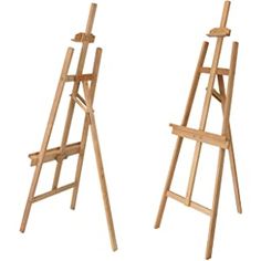 two wooden easels are standing next to each other