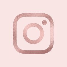 the instagram logo in pink and gold on a light pink background with a black border