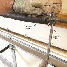 a man is working on the side of a window sill with tools attached to it