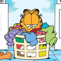 a cartoon cat sitting in a laundry basket