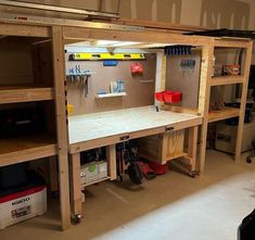 the workbench is built into the wall and has tools on it for storage