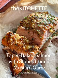 a piece of salmon sitting on top of parchment paper