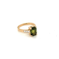 This is a very special one of a kind ring that is set in 14 karat yellow gold. The center stone is a Rare Natural Ceylon Green Sapphire with no indication of heat applied. This specialty mixed cut stone has a deep green tone with shades of soft yellow as well. The hardness on this stone is a 9 out of 10 on the Mohs scale. It weighs 3.25 carats and is surrounded by 6 Natural French Cut Square Diamonds weighing 0.26 carats total weight and the stones are graded G in color and VS2 in Clarity. These Gold Slides, Diamond Earrings Studs Round, Green Tone, Sapphire And Diamond Ring, Special One, Soft Yellow, Square Diamond, Green Sapphire, Custom Jewelry Design