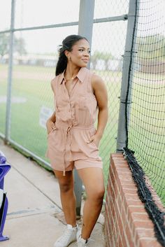 Elevate your summer style with our Rose Pink Collared Sleeveless Romper! This flowy and chic romper features a classic collar and a button-up design, while the tie waist adds a flattering touch. With pockets on both sides, it's both functional and fashionable. In a beautiful rose pink shade, it runs true to size for a perfect fit. runs true to size dress up or down model, Alyssa is wearing a size medium Summer Sleeveless Jumpsuit With Tie Waist, Chic Summer Jumpsuits And Rompers With Tie Waist, Spring Beach Collared Jumpsuits And Rompers, Spring Beach Jumpsuits And Rompers With Collar, Collared Jumpsuits And Rompers For Beach In Spring, Collared Jumpsuits And Rompers For Spring Beach, Chic Collared Jumpsuits And Rompers For Spring, Collared Jumpsuits And Rompers For Summer Vacation, Chic Collared Jumpsuits And Rompers For Summer