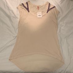 Nwt Free People Oatmeal Color Tee With Colorful Appliqu Accent On The Back And Shoulders. Very Comfortable And Perfect For Spring Or Summer! Casual Cream V-neck Top, Casual Oatmeal Tops For Summer, Casual Oatmeal Summer Tops, Beige Stretch Top With Scoop Neck, Cream Stretch Tops With Short Sleeves, Cream Stretch Short Sleeve Tops, Cream Scoop Neck Tops For Spring, Oatmeal Color, Accent Colors