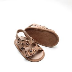 ***Looking for a larger size? Click HERE to see this same style with larger sizes in a hard sole.*** Our sandals are easy to dress up or down making them the best accessory. These cute sandals are just what your little one needs this summer! Genuine leather Leather lining Velcro strap for an easy on and off Leather soft sole provides comfort and protection for young babies and early walkers Handy heel strap makes sliding tiny toes into these shoes a breeze! Cute Closed Toe Summer Slippers, Cute Closed Toe Beach Slippers, Cute Non-slip Sandals For The Beach, Cute Non-slip Flip Flops With Round Toe, Brown Non-slip Sandals For Vacation, Vacation Slippers With Rubber Sole And Round Toe, Vacation Slippers With Round Toe And Rubber Sole, Casual Closed Toe Sandals With Buckle Closure, Cute Non-slip Sandals For Vacation