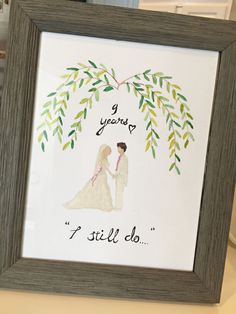 a framed wedding card with the bride and groom holding hands under a tree branch that says i y'all do