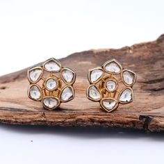 These natural polki diamonds flower pattern uncut studs! Handcrafted in 22k yellow gold, they're truly a work of art. The intricate meenakari colorful motifs are hand-painted, adding an extra touch of elegance. These earrings are a classic design with beautiful intricate enamel work, making them a must-have addition to any jewelry collection. Whether you're dressing up or just want to add a touch of sophistication to your everyday look, these earrings will always shine. They're perfect for any o 22k Gold Earrings, Always Shine, Diamond Flower, Diamond Stud, Perfume Spray, 22k Gold, Birthday Anniversary, Diamond Studs, Flower Pattern