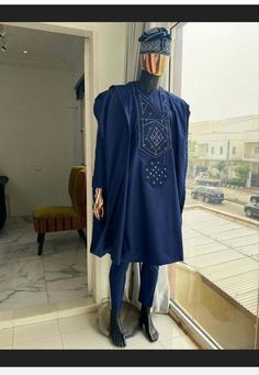 An elegant and stylish Agbada for men made with premium quality 100% cotton. Comes in navy blue with a well detailed embroidery design. Make a difference at an event with this trendy Traditional suit. This outfit can be worn to various formal events such as Weddings, Engagements, Church service, African Heritage Party, Black History Month Celebrations, festivals as well as other formal occasions. Blue Agbada, Agbada For Men, Men Kaftan, Yoruba People, Traditional Suit, Church Service, Bespoke Tailoring, Groom Suit, African Men