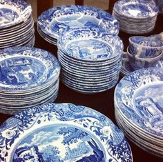 blue and white plates stacked on top of each other