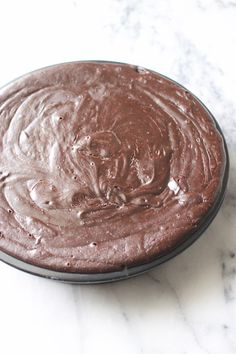 a chocolate cake sitting on top of a white counter