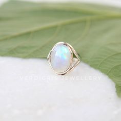 AAA Rainbow Moonstone ring, Real Sterling Silver ring, cocktail ring, alternative engagement ring, avant garde, birthstone ring, Rainbow Moonstone jewellery Description: Be assured that the product you order is MADE JUST FOR YOU and is not a mass produced item. The gemstone is a OVAL shaped AAA RAINBOW MOONSTONE GEMSTONE SIZE-16*12 mm. You have an option to choose a gem for yourself from a set of the stones. Please ask. The rest of the ring is made from 925 STERLING SILVER i.e 92.5% pure silver. Unique Opal Ring With Moonstone, Ethereal Moonstone Rings With Birthstone, Ethereal Opal Gemstone Jewelry, Ethereal White Moonstone Promise Ring, Iridescent Gemstone Promise Ring, Sterling Silver Moonstone Halo Ring Gift, Sterling Silver Moonstone Birthstone Ring, Sterling Silver Moonstone Ring With Halo For Gift, Minimalist Opal Ring With Moonstone