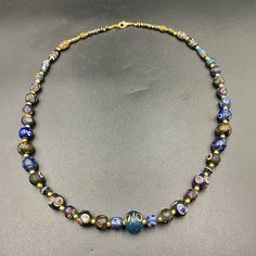 A beautiful multi color glass beads necklace from Ancient Romans time from Afghanistan some gold color brass beads are used as spacers in the necklace we provide fast and free shipping to our customers by which can get the items by 7 maximum working days Glass Necklace With Black Round Beads, Black Glass Beaded Necklaces, Spiritual Glass Beaded Necklaces, Black Glass Bead Jewelry, Glass Beads Necklace, Ancient Roman Glass, Beaded Jewelry Necklaces, Asian Countries, Glass Beads Jewelry