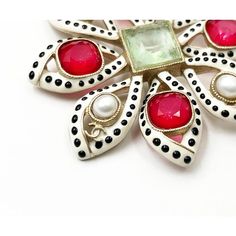 This is part of Chairish’s Costume Jewelry assortment.  Chanel Rare White Black Polka Dot Red Gem Pearl Large Brooch  *Marked 16 *Made in France *Comes with the original box  - It is approximately 2.75' x2.75". - Very pretty and artsy  - In a pristine condition Elegant Multicolor Collectible Brooches, Luxury Multicolor Brooches For Gifts, Luxury Multicolor Brooches As Gift, Elegant Red Brooches Collectible, Luxury White Brooch For Gift, Luxury White Brooches For Gifts, Luxury White Brooches As Gift, Designer White Brooches For Formal Occasions, Luxury Red Brooches For Formal Occasions