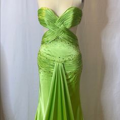 a green evening gown on a mannequin