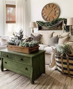 a living room filled with furniture and a large clock on the wall above it's head