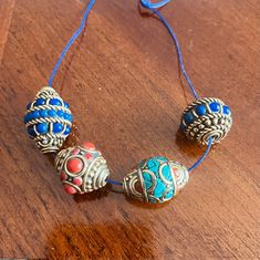 Price is only for one bead!! Measurement: B1 - Coral inlaid bead 20X15mm, hole size 1mm, 0.3oz weight B2 - Lapis inlaid bead 18X19mm, hole size 1mm, 0.3oz weight B3 - Turquoise / Coral inlaid bead 20X16mm, hole size 1mm, 0.30oz weight B4 - Lapis inlaid bead 23X18mm, hole size 1mm, 0.3oz weight Beautiful multiple colors handcrafted beads from Nepal. Great additions to your necklaces and bracelets making projects. Tibetan beads are very unique and still unlike made in China, every individual beads Blue Bohemian Beaded Bracelets With Large Beads, Bohemian Blue Beaded Bracelets With Oval Beads, Blue Bohemian Jewelry With Large Beads, Blue Bohemian Round Beaded Jewelry, Bohemian Large Blue Beads, Blue Beaded Bracelets For Festival With Polished Beads, Blue Polished Beaded Bracelets For Festivals, Blue Beaded Bracelets With Silver Beads For Festivals, Bohemian Blue Round Bead Jewelry